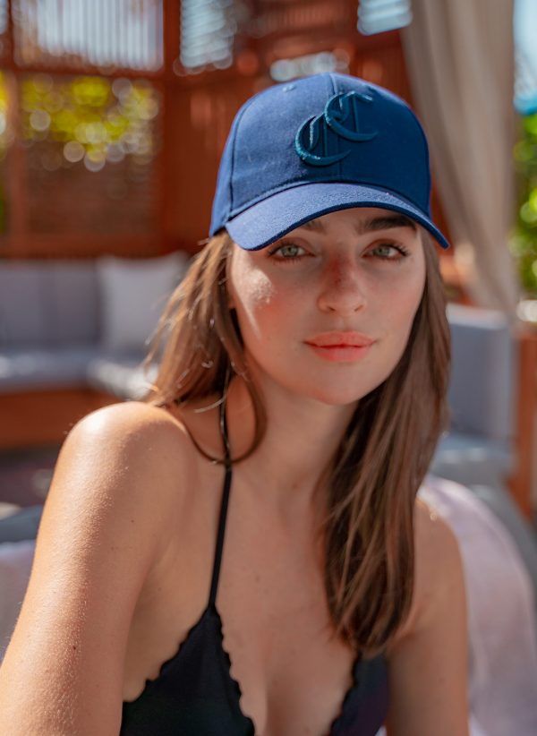 The Burleigh Cap is a classic navy baseball cap style with logo embroidery. Part of the CAHA CAPO accessories range.