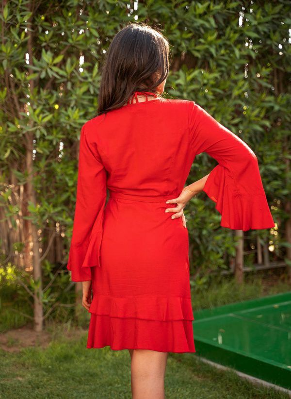 The Sharon in red is a flattering wrap dress with fluted sleeves. Part of the CAHA CAPO women's resortwear collection.