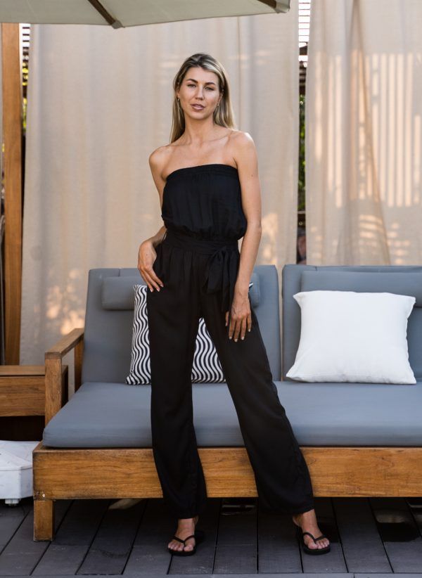 The Stella in black is a women's jumpsuit made in viscose dobby. Part of the CAHA CAPO women's resortwear collection