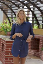 The Addison is a long line shirt dress in navy. With self-fabric belt. Part of the CAHA CAPO women's resortwear collection.