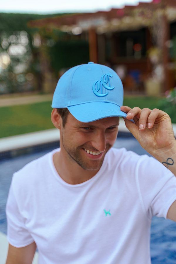 The Burleigh Cap is a classic blue baseball cap style with logo embroidery. Part of the CAHA CAPO accessories range.