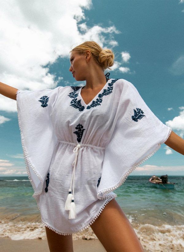 The Evie in navy & white is a breathable cotton kaftan with embroidery. Part of the CAHA CAPO women's resortwear collection.