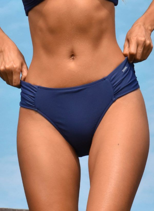 The Janice navy bikini bottom by CAHA CAPO is a supportive and stylish full coverage bikini bottom. Featuring CAHA CAPO trims