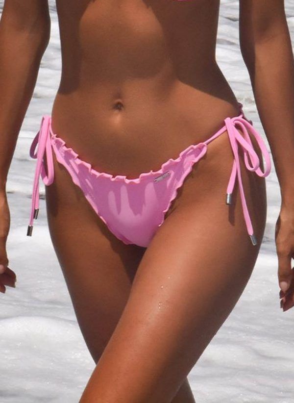 The Louise hollywood pink bikini bottom by CAHA CAPO is a tie side, Brazilian bikini bottom. It has a low waist and Features CAHA CAPO trims