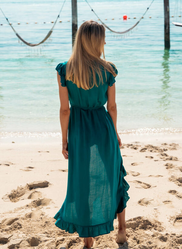 The Lizzie in dark green is a maxi length wrap dress that is perfect for wearing over swimwear. Part of the CAHA CAPO resortwear collection.