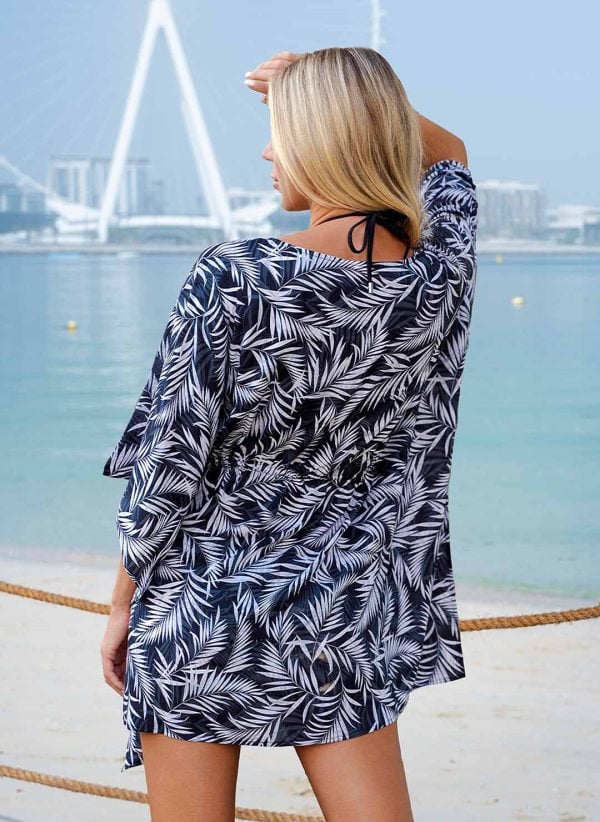 The Sally kaftan is a Mono Palm print kaftan with a V-neck and adjustable drawcord. Part of the CAHA CAPO resortwear collection.