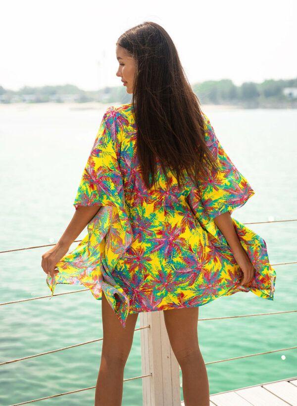 The Sally kaftan is a Sunset Tropicana print kaftan with a V-neck and adjustable drawcord. Part of the CAHA CAPO resortwear collection.