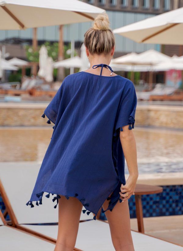 The Katherine kaftan is a navy cotton kaftan with a V-neck and adjustable drawcord. Part of the CAHA CAPO resortwear collection.