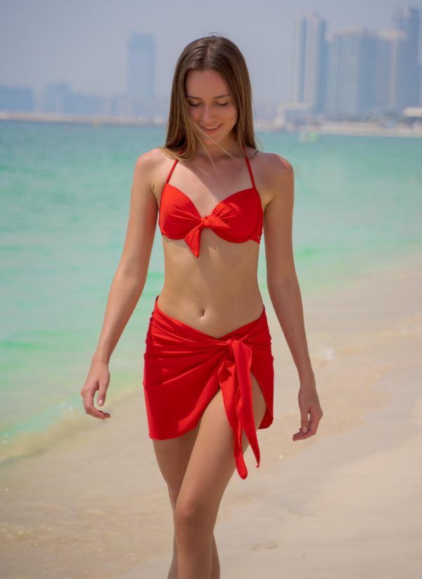 The Marina is a versatile red sarong that is made in the same fabric as the CAHA CAPO swimwear collection. The perfect beach accessory.