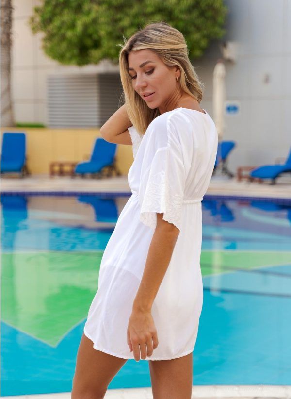 The Steph kaftan is a white viscose kaftan with a low V-neck and adjustable drawcord. Part of the CAHA CAPO resortwear collection.