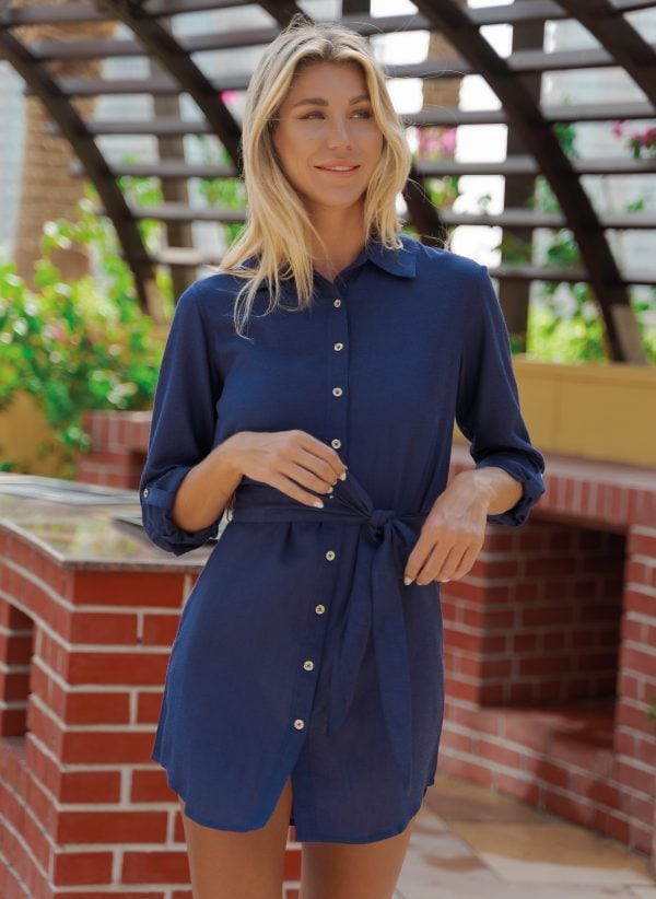 The Addison is a long line shirt dress in navy. With self-fabric belt. Part of the CAHA CAPO women's resortwear collection.