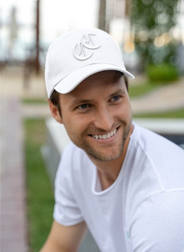 The Burleigh Cap is a classic white baseball cap style with logo embroidery. Part of the CAHA CAPO accessories range.